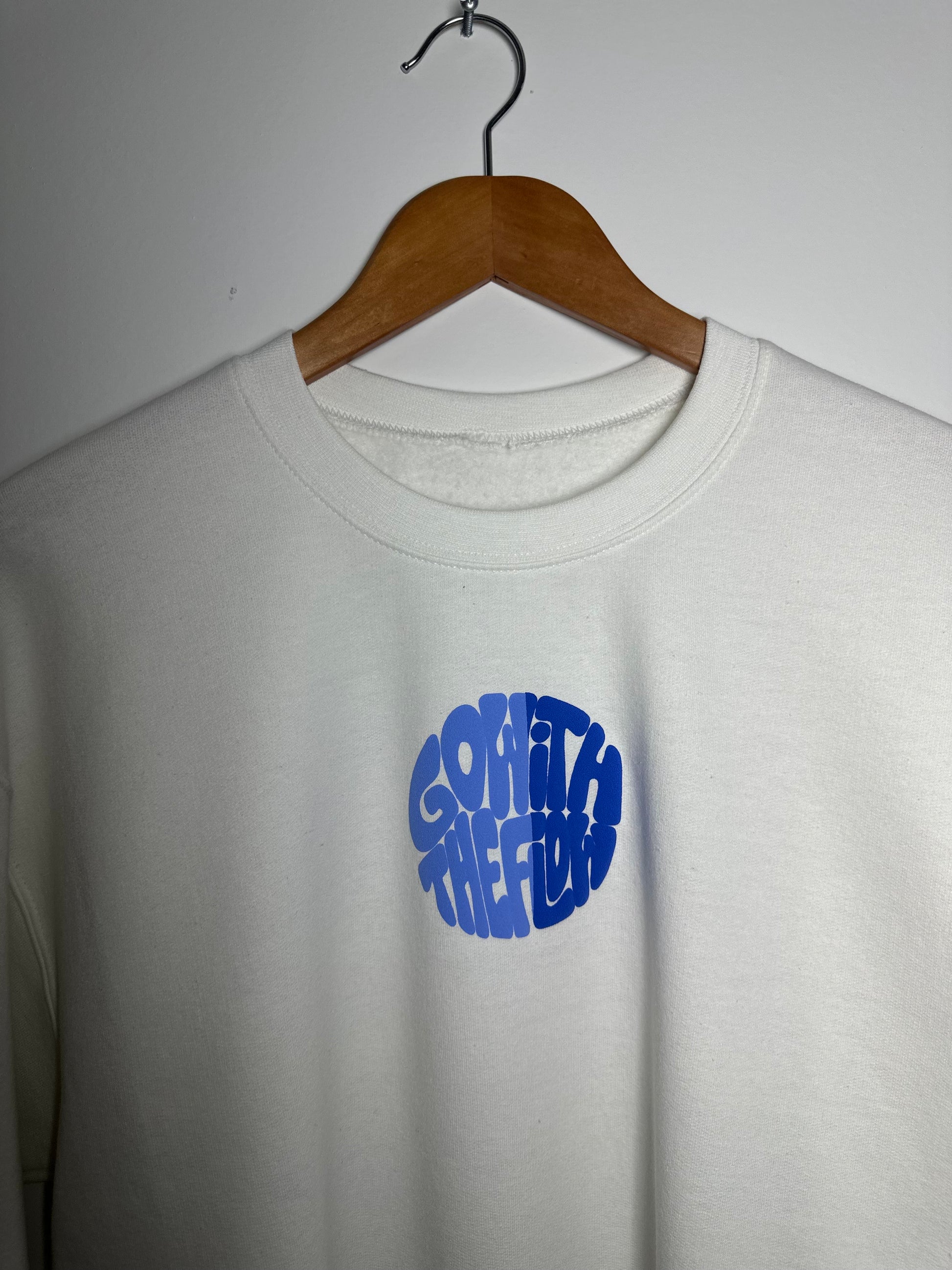GO WITH THE FLOW SWEATER